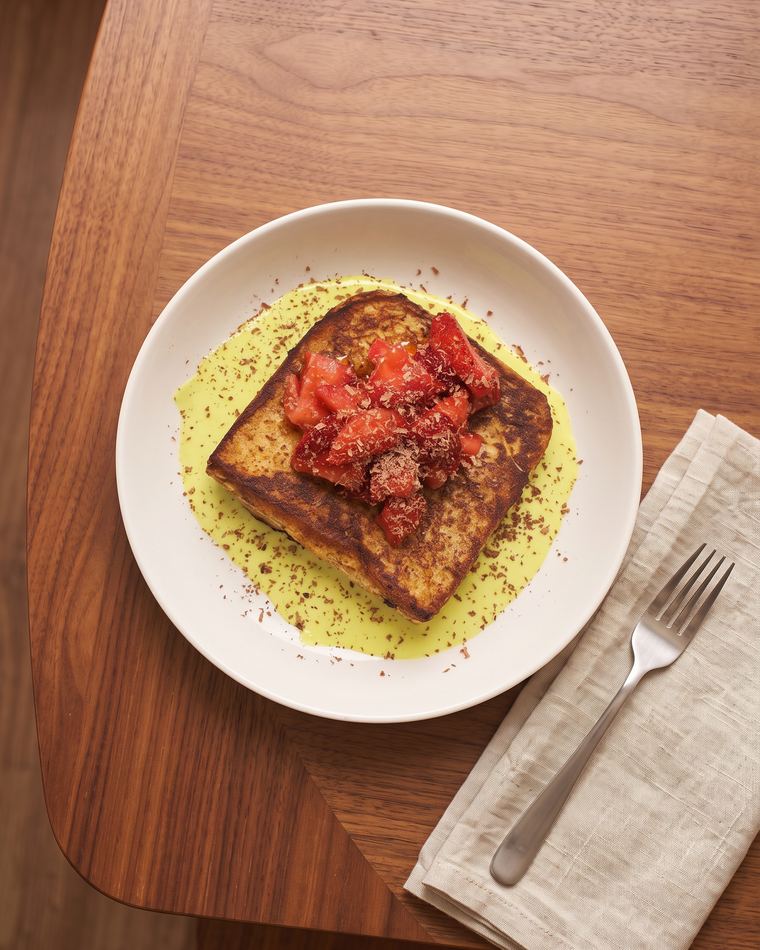 Pistachio French Toast with pistachio cream, macerated strawberries and dark chocolate